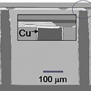 x-SEMs of ECM interposer showing TSV contact point (left) and frontside metal stack (right); TSVs are unfilled (barrel coated)